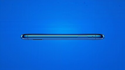 Slim Metallic Electronic Device on Blue Background