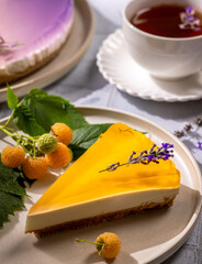 Delicious cheesecake slice with jelly and lavender topping