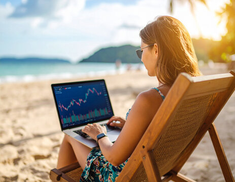 woman trading stocks on the beach, working remotely with financial freedom - Powered by Adobe