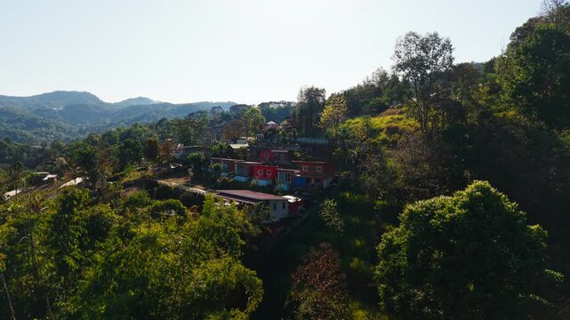 Multiple views of the wat pong yaeng nok buddhist temple nestled in the lush forested mountains of thailand