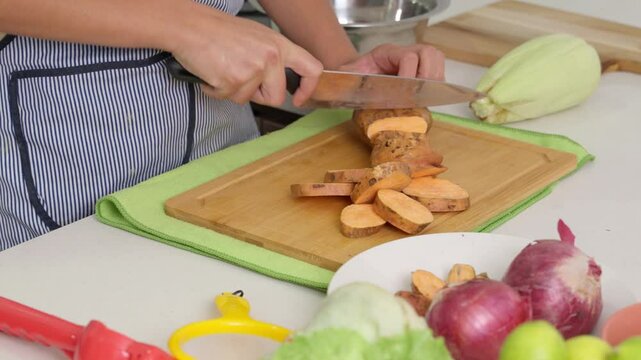 Chef slicing sweet potato for peruvian ceviche