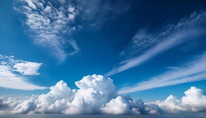 soft billowy cumulus clouds create a serene atmosphere as they float in a vibrant blue sky this versatile cloud formation can enhance various creative projects with its natural beauty and airy feel