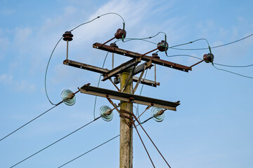 Wooden Utility Pole with Electricity Power lines and High Voltage Connections