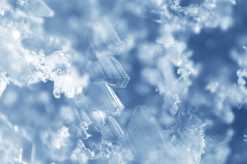 Ice crystals are solid water in symmetrical shapes including hexagonal columns, hexagonal plates, and dendritic crystals