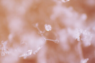 Ice crystals are solid water in symmetrical shapes including hexagonal columns, hexagonal plates, and dendritic crystals