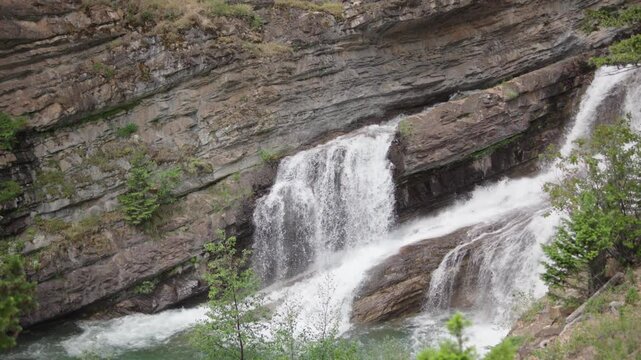 Close up of flowing water on Cameron falls in Canada 