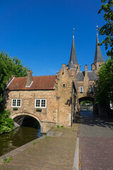 Eastern Gate (Oostpoort) in Delft, is an example of Brick Gothic northern European architecture that was built in 14th century. Delft, The Netherlands.