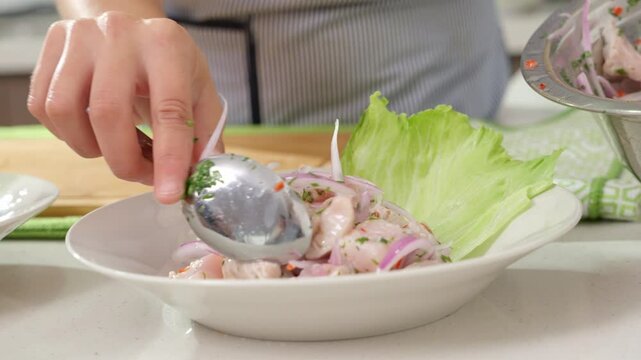 Chef preparing delicious peruvian ceviche in a modern kitchen