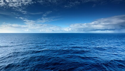 Fototapeta premium vast expanse of the atlantic ocean deep blue waters stretching to the horizon under a dramatic sky perfect for travel nature and ocean themed projects ocean oceanscape