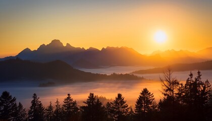 Obraz premium majestic mountains silhouetted against a vibrant sunrise radiating soft light across a serene misty landscape