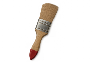 Red-tipped paintbrush resting on clear surface, wooden handle and metal ferrule ready for graphic design compositions
