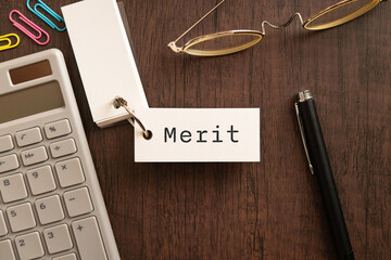 There is word card with the word Merit. It is as an eye-catching image.