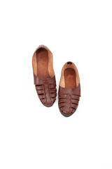 A pair of brown casual leather shoes isolated on white background, perfect for leather industry catalog design
