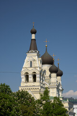 An Iconic Orthodox Church with Its Distinctive Domes Set Against a Clear Blue Sky