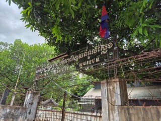Phnom Penh, Cambodia - 25 June 2025. The entrance sign of Tuol Sleng Genocide Museum is mounted on...