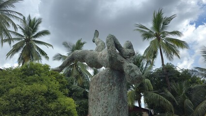 Phnom Penh, Cambodia - 25 June 2025. A bronze statue at Tuol Sleng Genocide Museum shows a person...