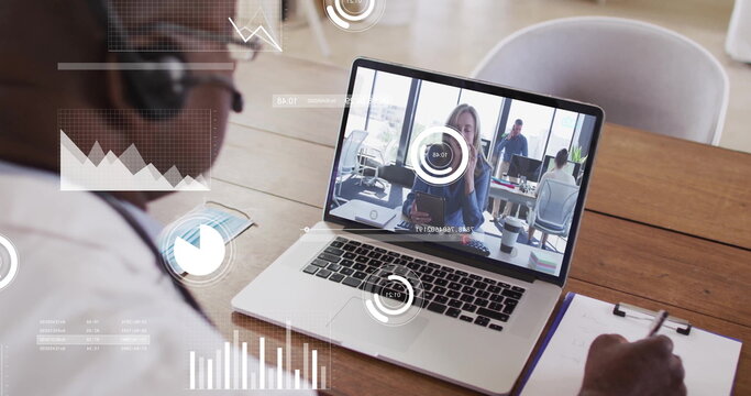 Writing man with headset taking notes with pen on clipboard at conference table, laptop, copy space