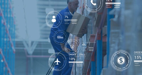 Handling depot worker in blue coveralls moving box on lower rack in depot, with digital graphics