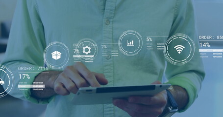 Man wearing green shirt tapping tablet in office with order tracking icons, IDs and percentages