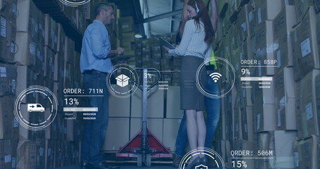 Analyzing digital order overlays warehouse staff using tablet near red pallet jack inside aisle