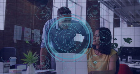 Collaborating coworkers leaning over laptop screen in office with biometric security overlay