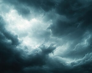 Obraz premium Dark, dramatic storm clouds in a turbulent sky with bright light breaking through, evoking a sense of power and tension