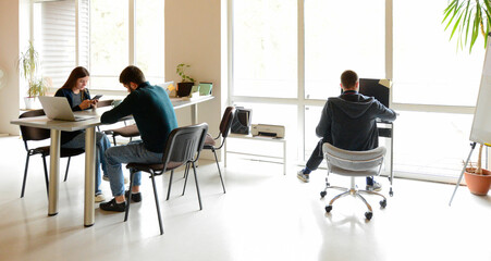 group of young professional people working in the office