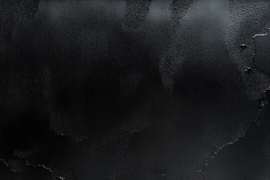 Close-up texture of black metal surface with irregular peeling paint and worn areas creating a rough, industrial feel - Powered by Adobe