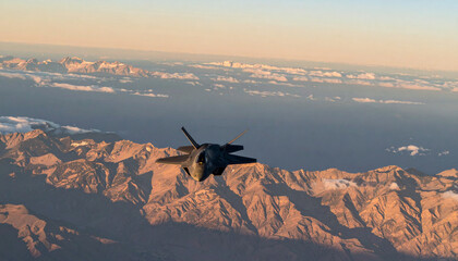 An F-35 fighter jet soaring above a mountain range during a sunset flight.