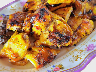 Grilled Chicken Pieces on Decorative Plate