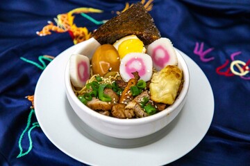Delicious Ramen Bowl with Toppings Noodles Egg Pork and More. Lámen