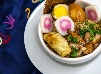 Delicious Ramen Bowl with Toppings Noodles Egg Pork and More. Lámen