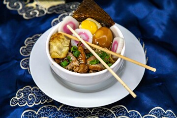 Delicious Ramen Bowl with Toppings Noodles Egg Pork and More. Lámen