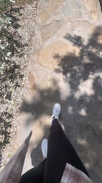 pov walking down stairs, stone staircase view, person descending steps, charming stone stairs, scenic stairway perspective, joyful walk down steps, graceful stone path, refreshing outdoor steps, lovel