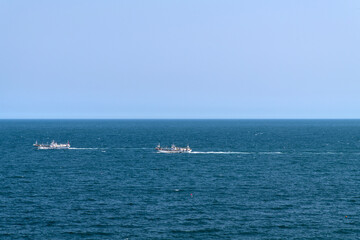idyllic seascape with fishing boats