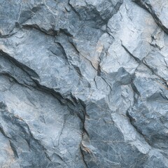 Close-up of a rough, textured stone surface, exhibiting a cool gray tone and a network of thin, lighter veins running throughout its irregular, fractured form