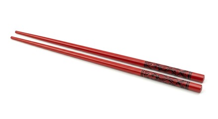Red chopsticks with ornate design on white background