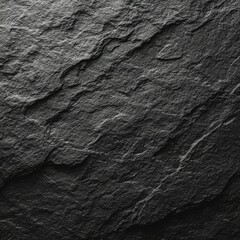 A close-up shot reveals the rough texture of dark gray stone,