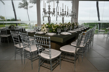 table set in ballroom, elegant wedding reception table with candlesticks, luxury dinner arrangement...