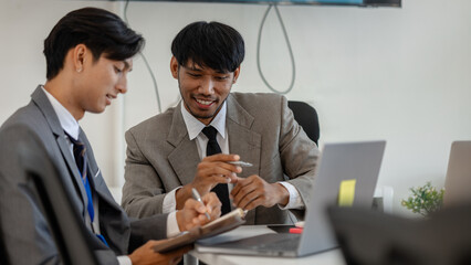 employees are discussing marketing strategies in a conference room, businesspeople are discussing...
