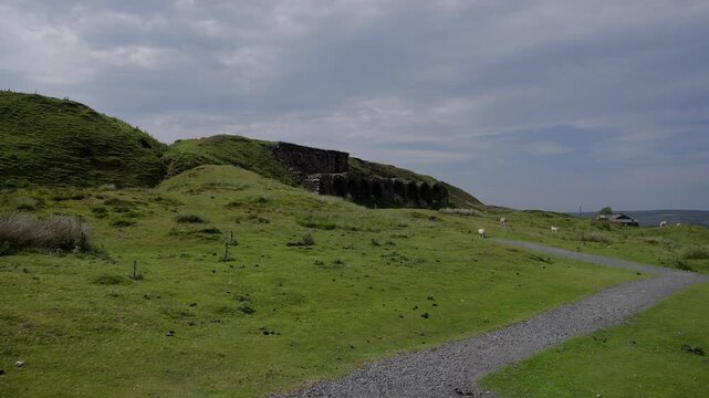 Gravel path leading towards the old ironstone mine calcining kilns at Rosedale Chimney Bank in North York Moors National Park, England