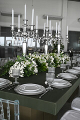 table set in ballroom, elegant wedding reception table with candlesticks, luxury dinner arrangement...