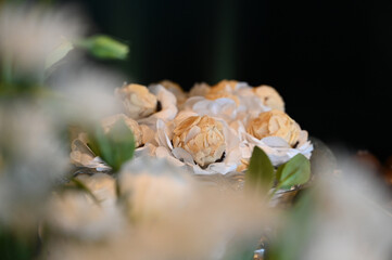 elegant handmade sweets for event, floral-style candy arrangement, artisan treats with delicate wrapping, candy balls,  close up sweets, candy table

