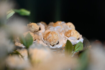elegant handmade sweets for event, floral-style candy arrangement, artisan treats with delicate wrapping, candy balls,  close up sweets, candy table

