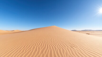 A vast desert landscape showcasing gentle sand dunes under a clear blue sky, evoking a sense of tranquility and adventure.