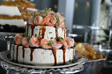 shrimp terrine with tare sauce, shrimp terrine, buffet food in restaurant, haute cuisine, close up of terrine	