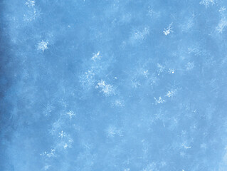 Macro photograpy of snowflakes. Background of winter fluffy snow texture.