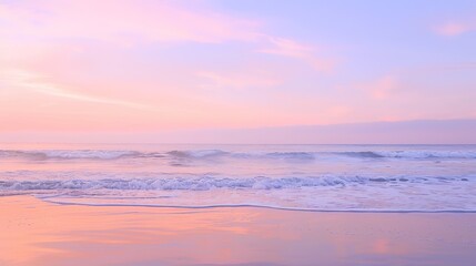 Fototapeta premium Soft pastel sunset painting the sky over a calm ocean beach, with gentle waves lapping the shore. The sky blends hues of pink, blue, and purple, while the water mirrors the serene colors, 