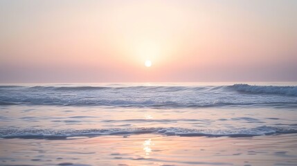 Obraz premium Soft pastel sunset painting the sky over a calm ocean beach, with gentle waves lapping the shore. The sky blends hues of pink, blue, and purple, while the water mirrors the serene colors, 