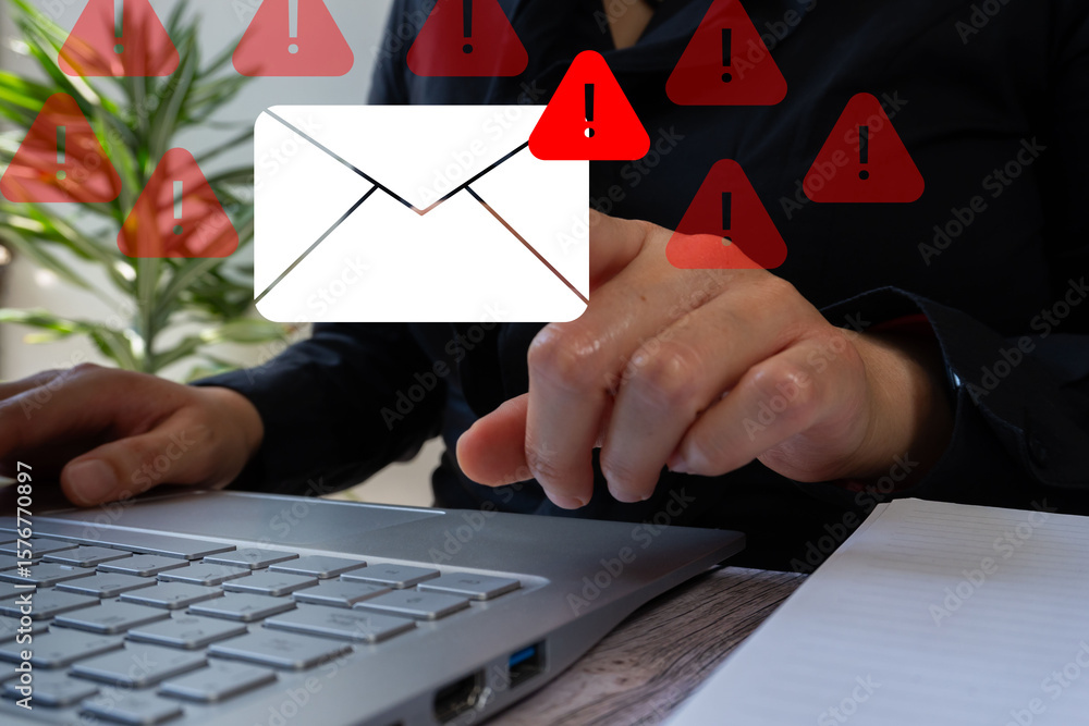 Poster close-up of a person's hands sitting in front of a laptop pointing at an email envelope icon with a 